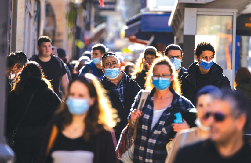 People walk on Jaffa Street in Jerusalem last week, some wearing masks, others not. (photo credit: OLIVIER FITOUSSI/FLASH90)