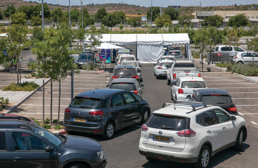 ISRAELI MOTORISTS line up at a drive-through COVID-19 test complex in Modi’in, last week. (photo credit: YOSSI ALONI/FLASH90)