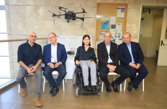 Prof. Lior Elbaz, who is developing hydrogen-based technology that powers drones, Bar-Ilan Council of Trustees Chairman Shlomo Zohar, Minister of Energy Karine Elharrar, Bar-Ilan President Prof. Arie Zaban and CEO Zohar Yinon. (photo credit: BAR-ILAN UNIVERSITY)